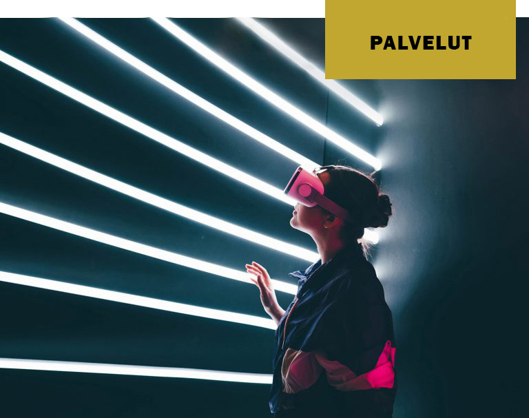 Girl using VR goggles in colorful neon lights.