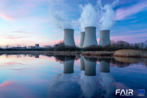 Nuclear power plant after sunset. Dusk landscape with big chimneys.