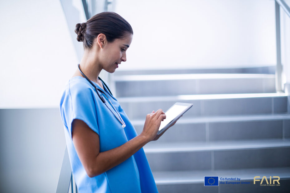 Female surgeon using digital tablet