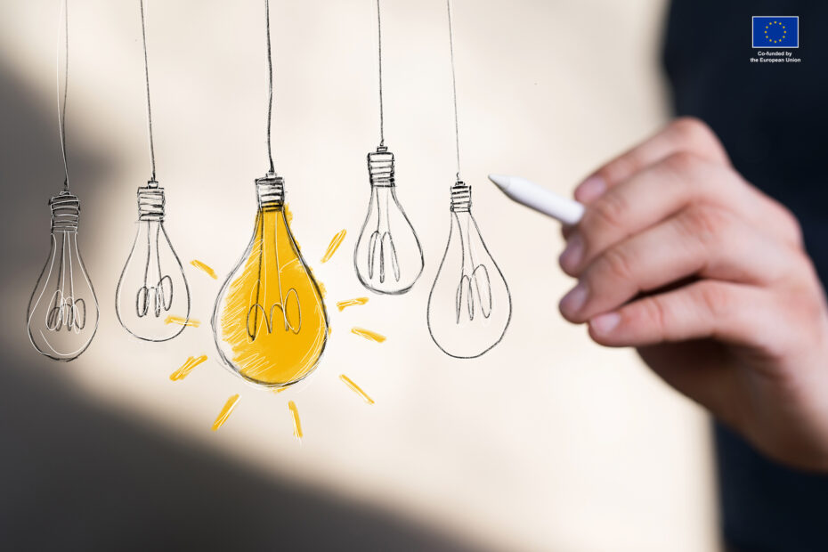 Light pulbs and one of the is on. Hand is pointing at the one with light.