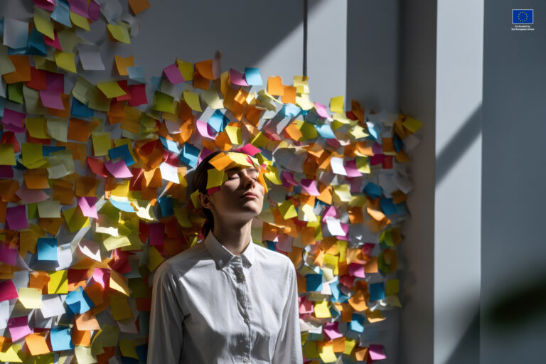 A woman surrounded by post-it stickers looking stressed