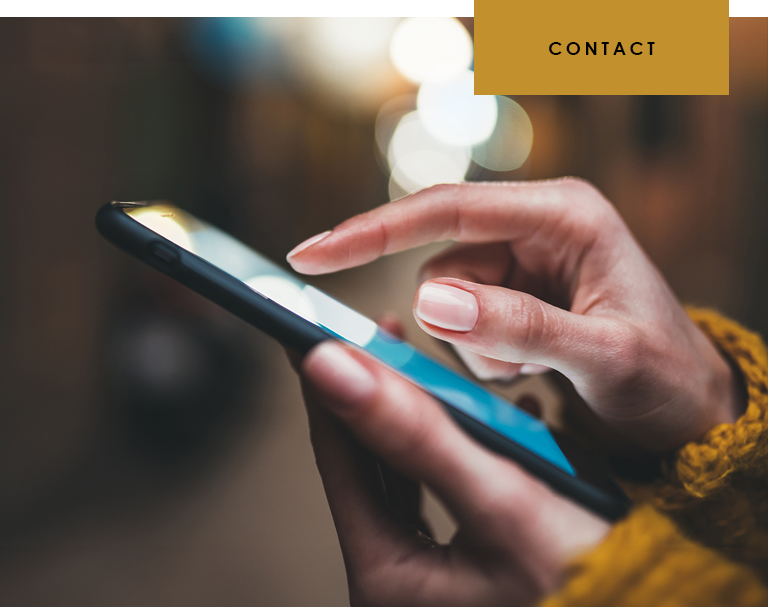 Person contacting someone with a mobile phone.