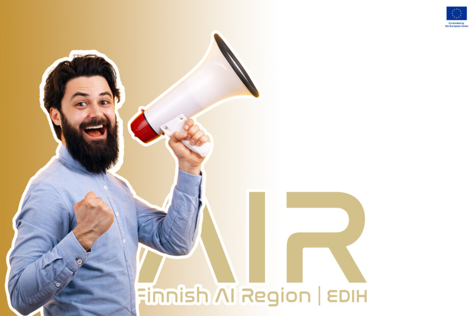 Bearded man holding a megafone and looking cheerful. behind is fair logo