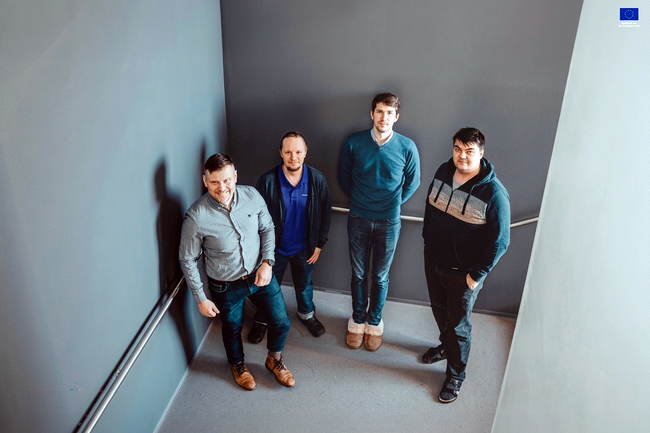 Quanscient Core Team in a hallway. Photo by Quanscient